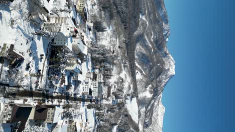 tilt up aerial reveal of mount myoko, akakura, portrait video