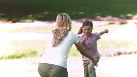 mother in slow motion holding her daughter