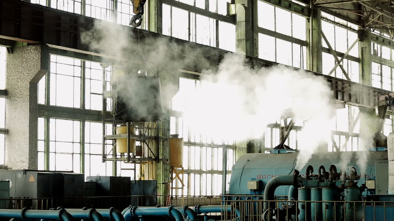 Overhead crane in factory workshop. Factory overhead crane inside factory building