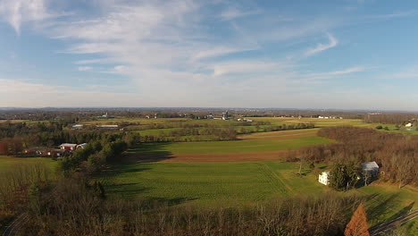 aerial shot of rural landscape.  camera point-of-view descends