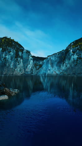 a serene lake with mountains in the background