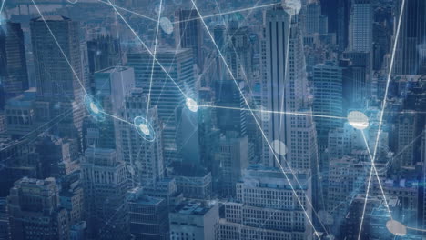 animation of network of connections and data processing against aerial view of cityscape