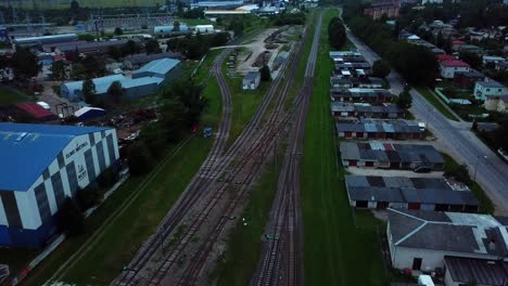 aerial view of industrial railway tracks and buildings