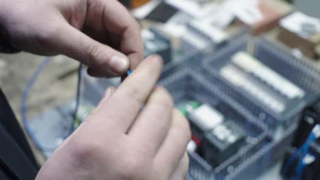 electrician working on an industrial control panel