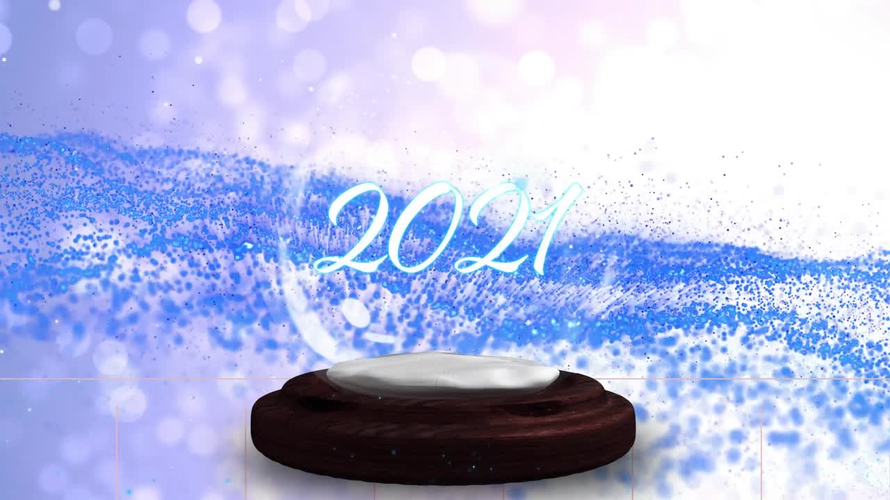Animation von Schnee und Lichtflecken über einer Schneekugel mit dem Text 2021.