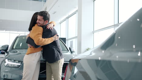 customer buying a new car in a modern car showroom
