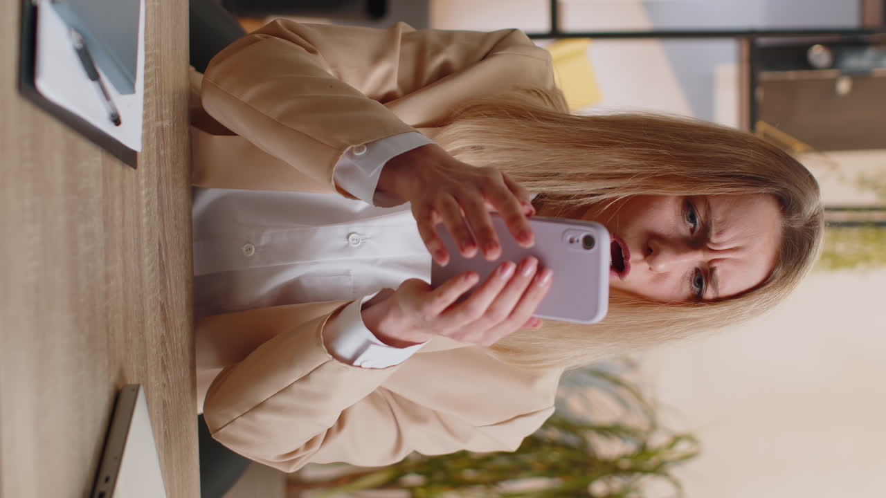 Young office business woman use smartphone surprised by bad news fortune loss fail lottery results