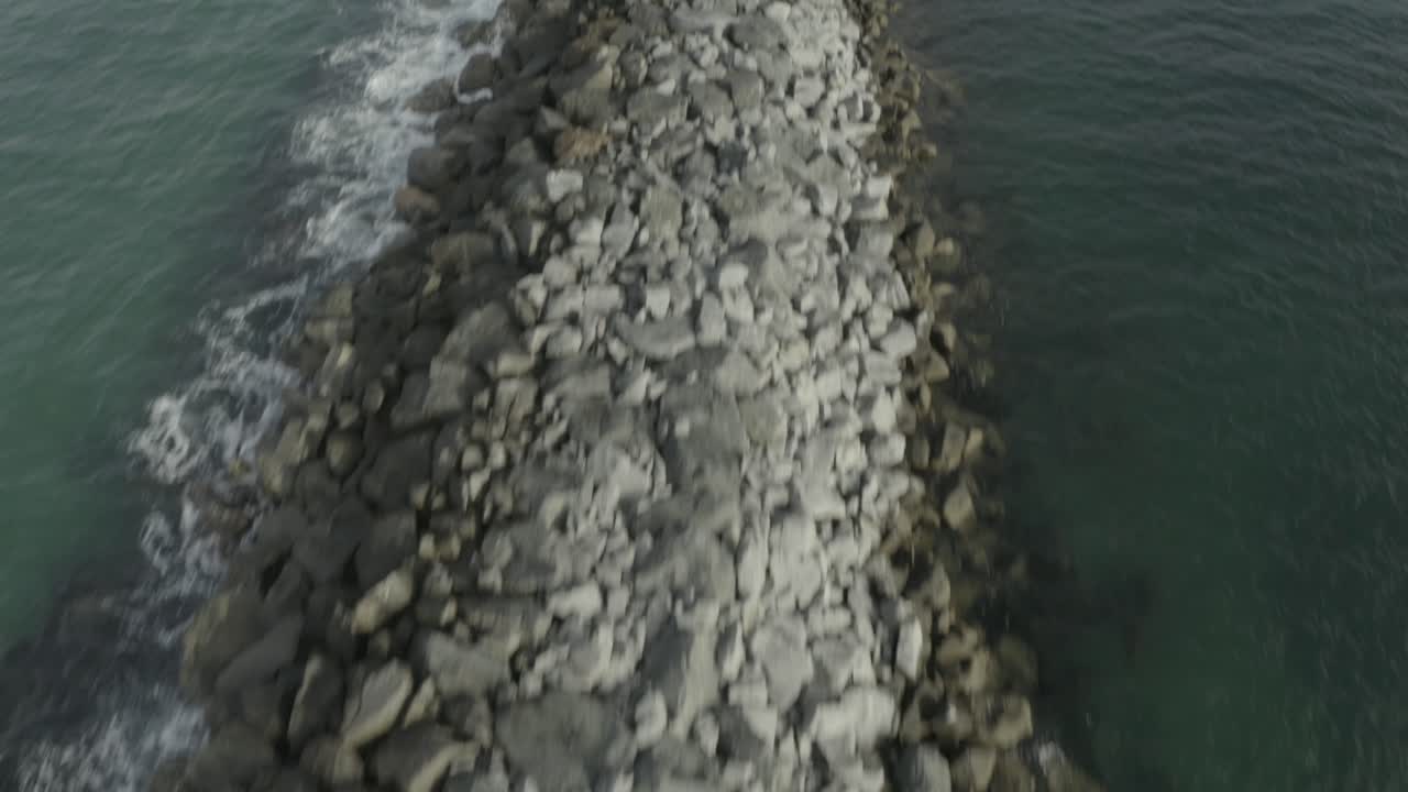 Beautiful aerial drone of California coastal beach with boats in the harbor - Ungraded