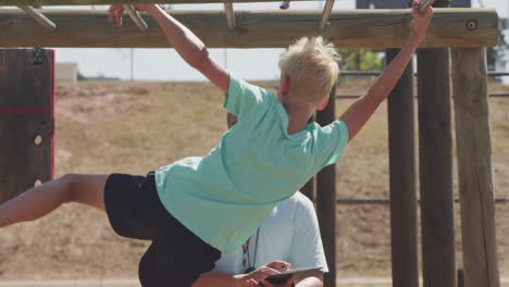 Caucasian-boy-training-at-boot-camp-