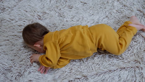 baby on a fuzzy carpet