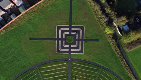 modern square target cemetery pathway design aerial top view descending above artistic garden of rest graveyard