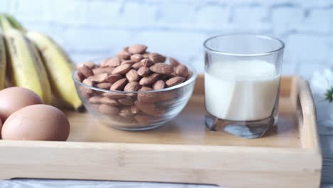 healthy breakfast with almonds, milk, and bananas