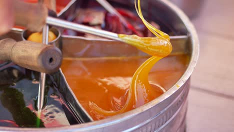 sweet treats being made at a street market