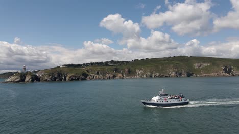 drone shot of a boat sailing on a sunny day in dublin