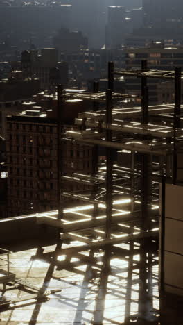 a steel construction frame on a rooftop in a city