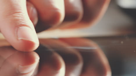 close up hands touching tablet computer