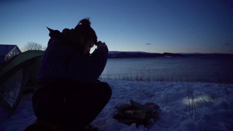 Man-Wears-Headlamp-At-Night-To-Feed-His-Dog