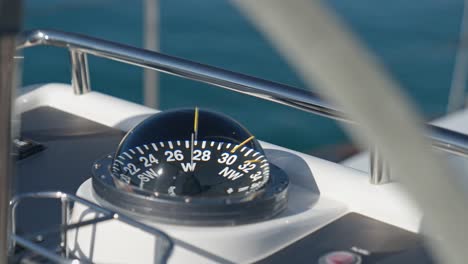 rounded external nautical compass on yacht