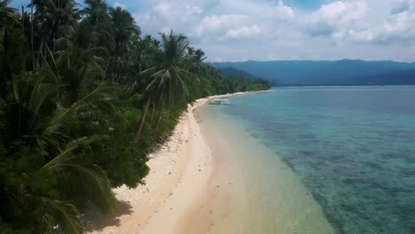 low altitude fpv drone flight along tropical beach shoreline in the philippines
