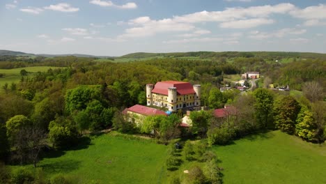 Aerial view of the female Castle. Czech castle on top of the hill. Divci Hrad, Czech Republic 4K
