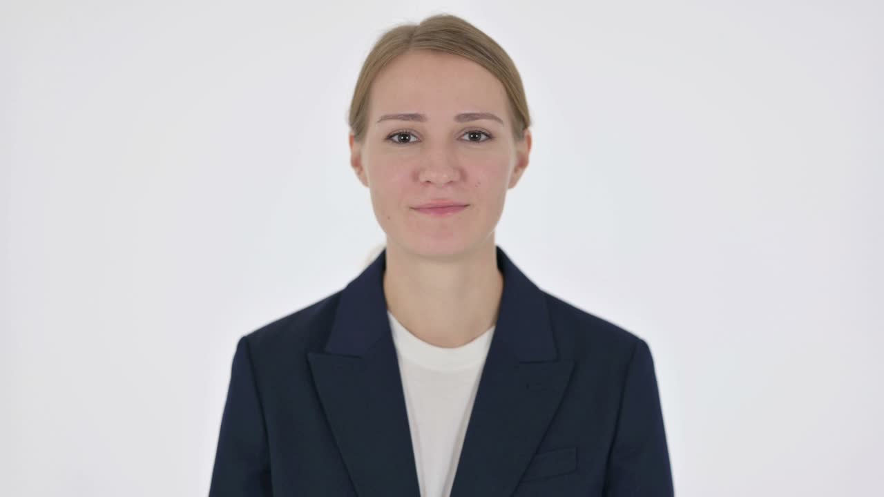 Young Businesswoman Praying with Fingers Crossed on White Background