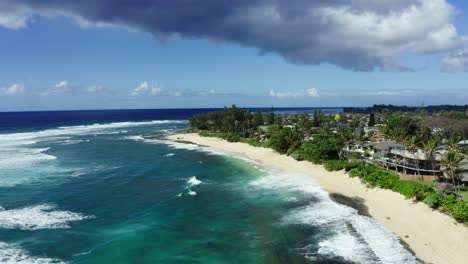 sunset beach on oahu's warm tropical coast, aerial view