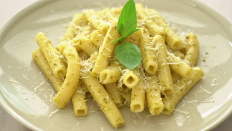 pesto-rigatoni-pasta-with-parmesan-cheese---Italian-food-and-vegetarian-food-style