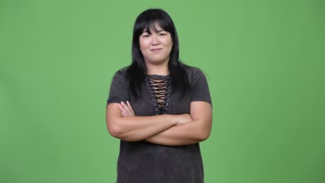 beautiful overweight asian woman with arms crossed