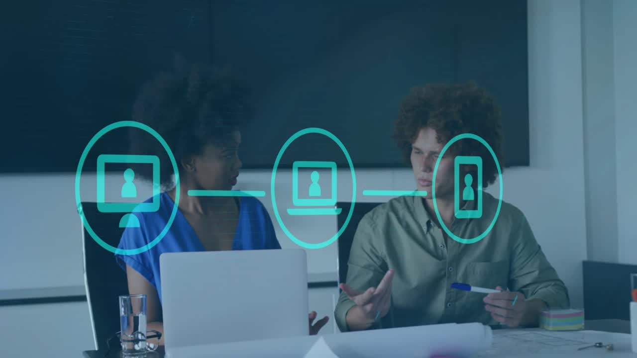 Animation of media icons over diverse business people in office