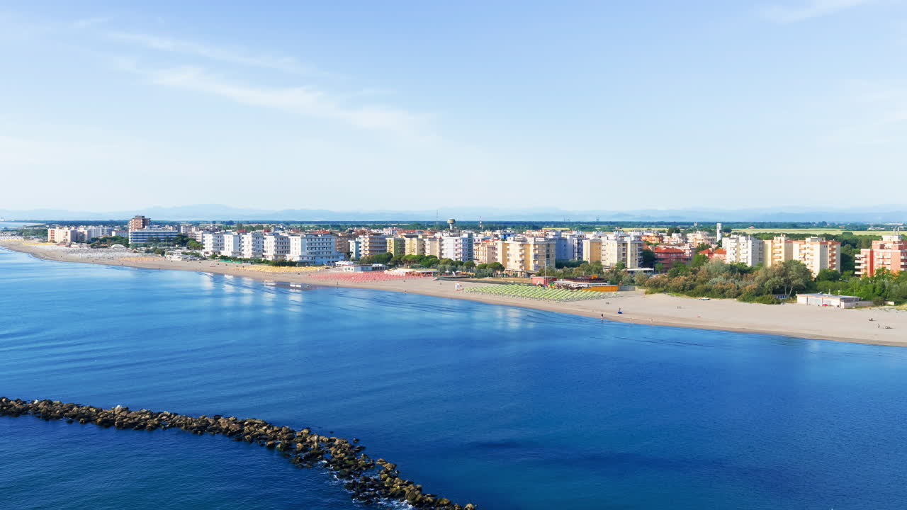 Nice drone view of the umbrellas and gazebos on Italian sandy beaches. Adriatic coast. Emilia Romagna region