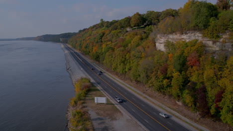 aerial over river road and bluffs pans left to reveal mississippi river