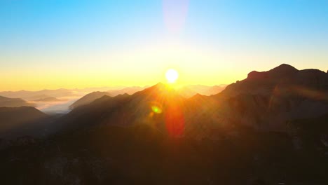 cinematic flight in the alps at sunrise