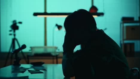 medium silhouette video of a offender perpetrator or prisoner sitting in the room the detective medium silhouette video of a offender perpetrator or prisoner sitting in the room the detective brings him a cup of water and begins the interrogation process true crime documentary creative