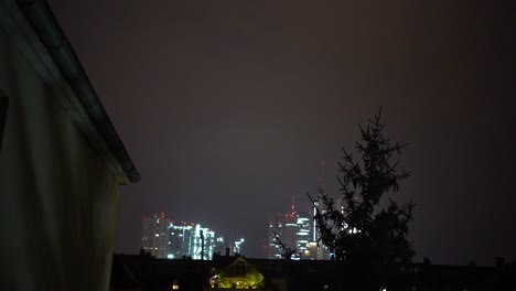 lightning illuminates the night sky over frankfurt, highlighting the city skyline