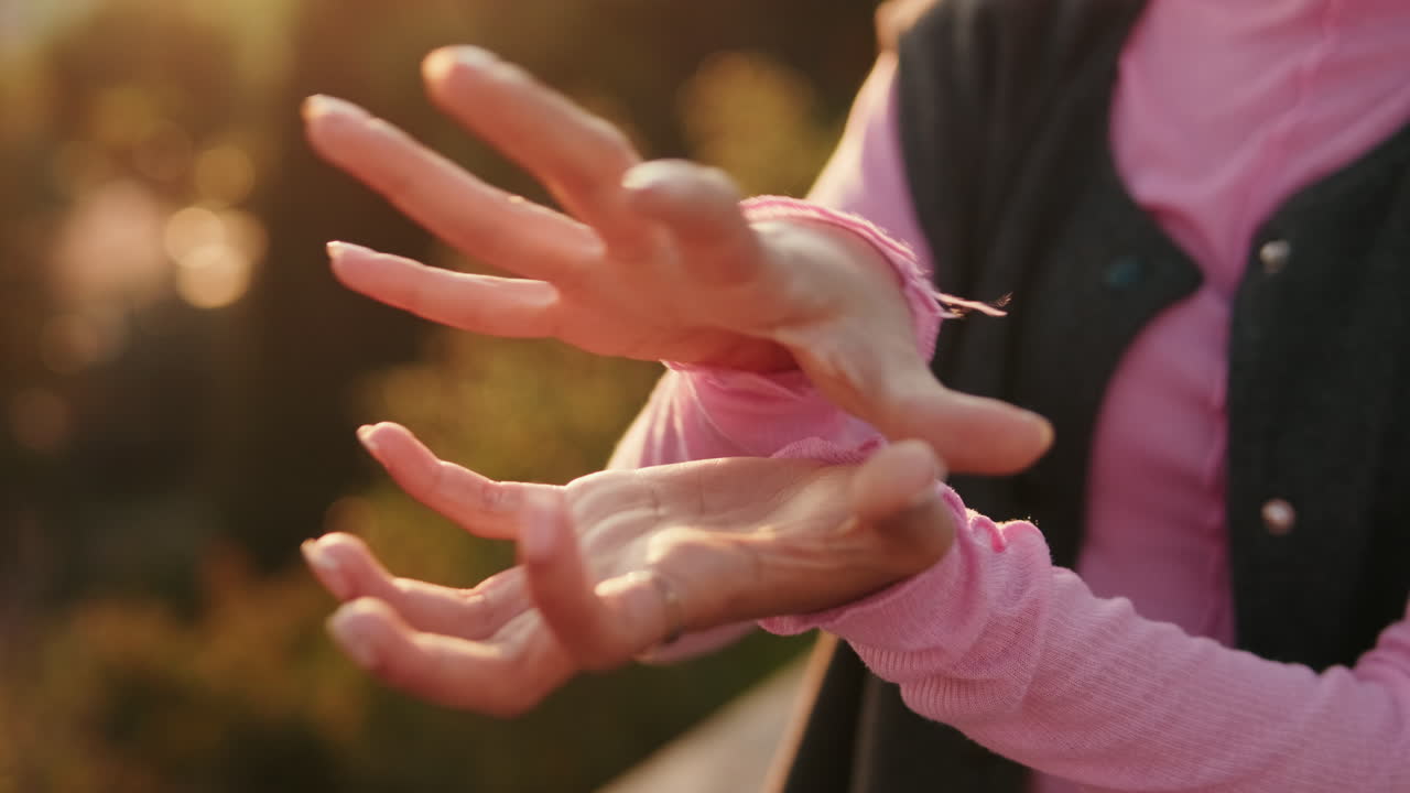 Woman's Hands in Golden Sunlight