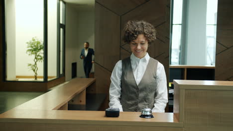 hotel receptionist welcoming guests