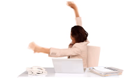 Businesswoman-celebrating-at-her-desk