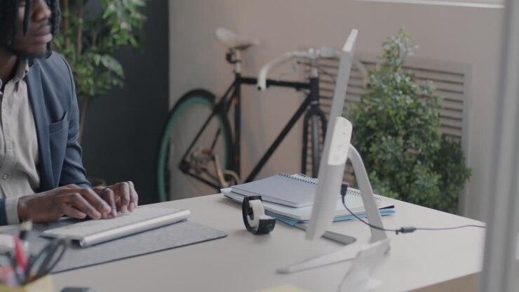Businessman Working on Computer in Modern Office
