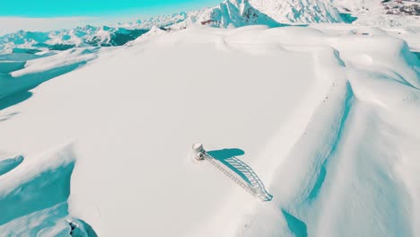 Diving-shot-down-a-ridge-of-a-snowy-mountain-range-in-the-alps