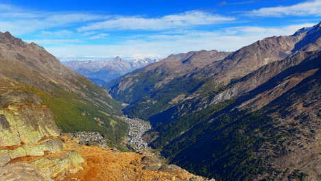 Summer-Alphabel-Saastal-Saas-Fee-Grund-Switzerland-top-of-Swiss-Alps-alpine-valley-glacier-mountain-peaks-summer-early-morning-stunning-vibrant-clear-blue-sky-Zermatt-pan-left-slowly