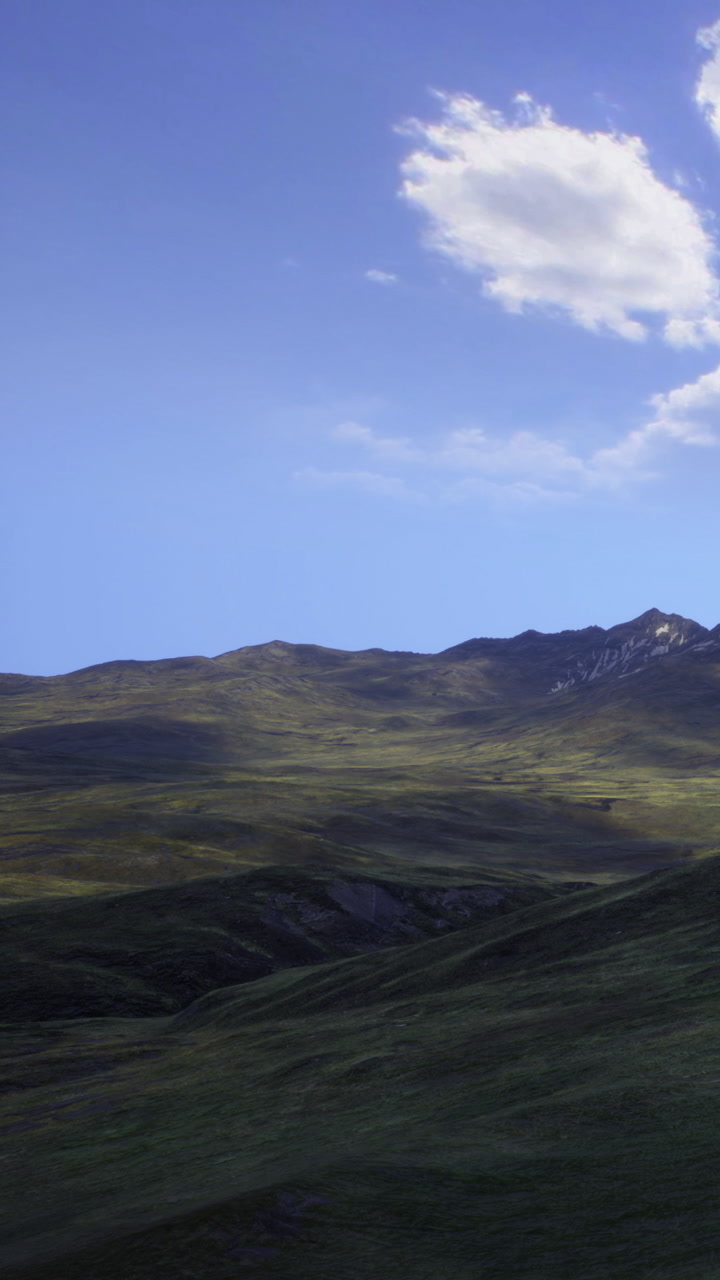 A serene landscape showcasing rolling hills and a clear blue sky in daylight