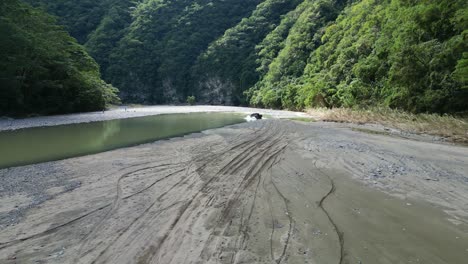 Off-road-4x4-crossing-river,-Muchas-Aguas-in-Dominican-Republic