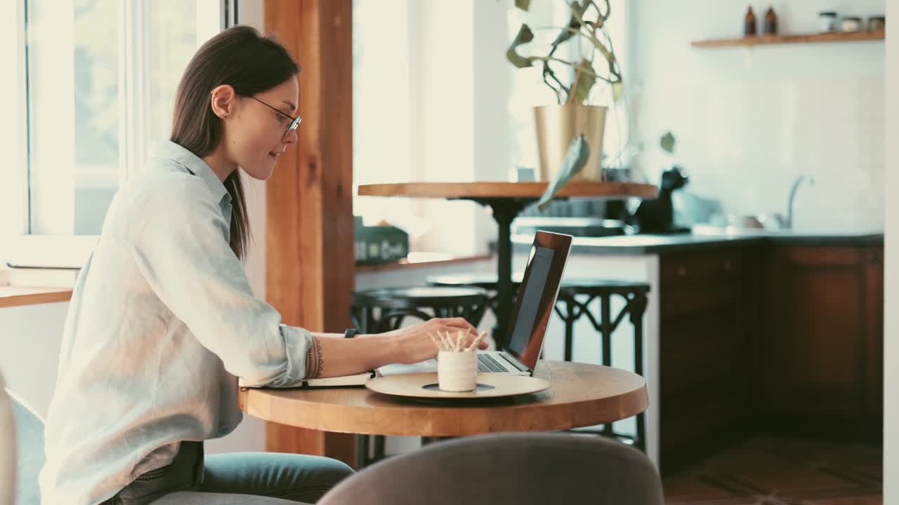 Young woman using a laptop in her home