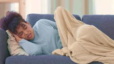 woman suffering from pms pain while laying