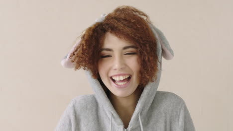 portrait of cheerful mixed race woman laughing  wearing cute outfit