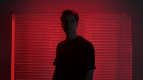 stylish man in red neon light