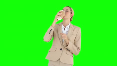 businesswoman drinking coffee to go