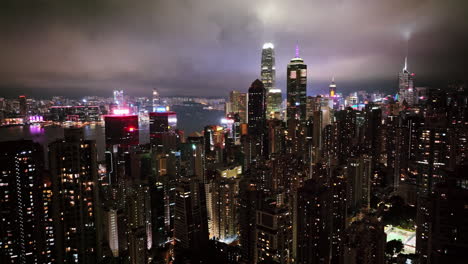 a view of a city at night from the top of a skyscraper