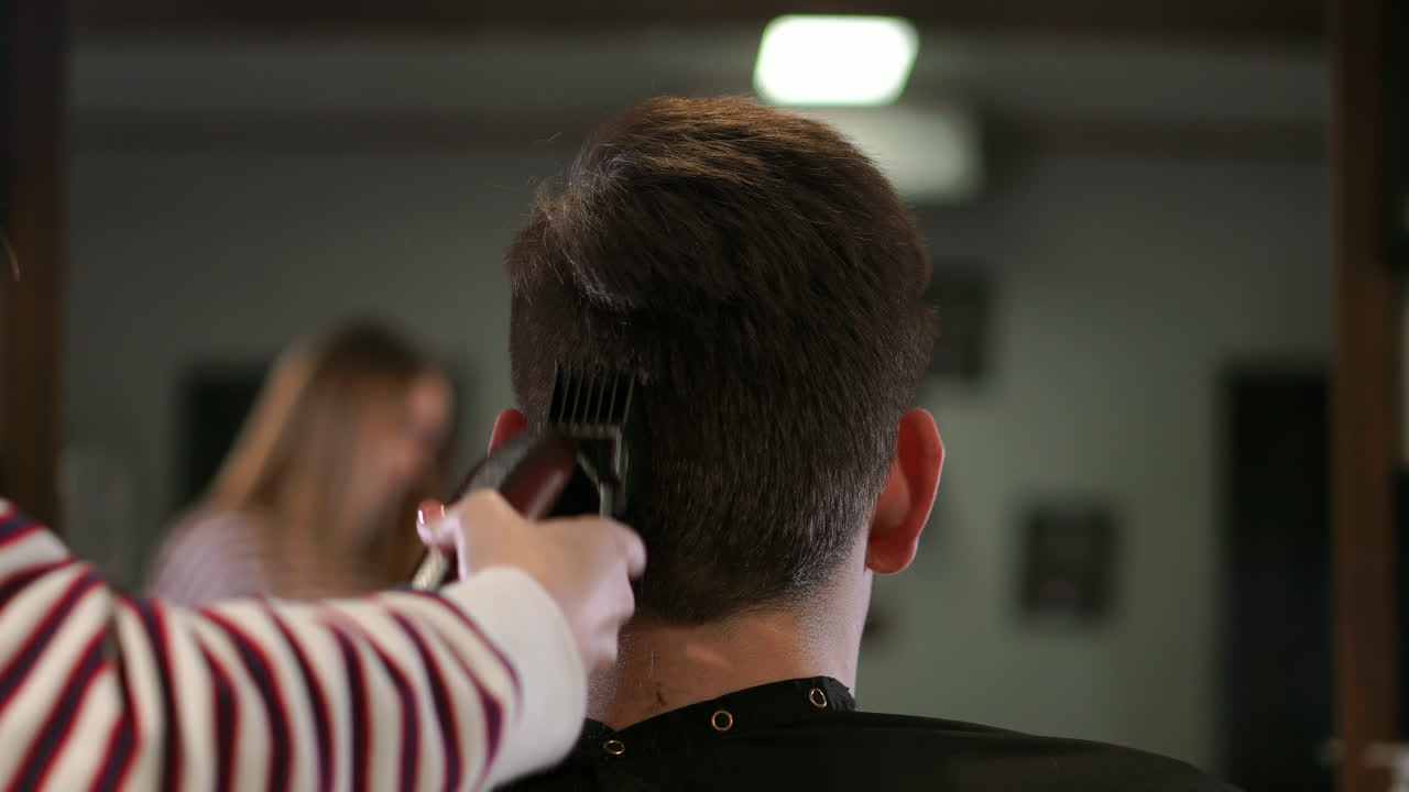 Man having a haircut with a hair clippers
