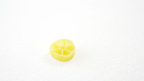rotelle pasta on white background